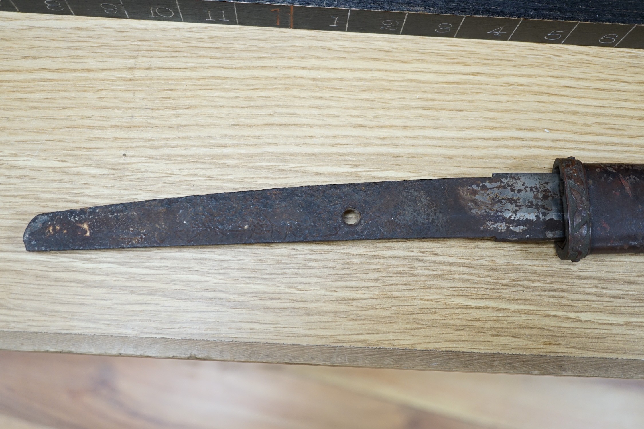 A Japanese Type 94 military sword lacking tsuba and hilt. Signed tang. 90cm excl scabbard